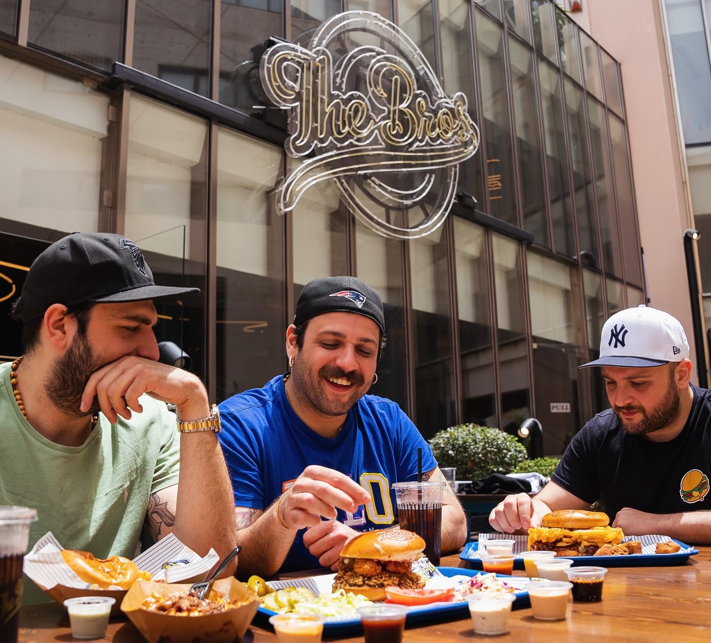 Founders sharing burgers at the patio