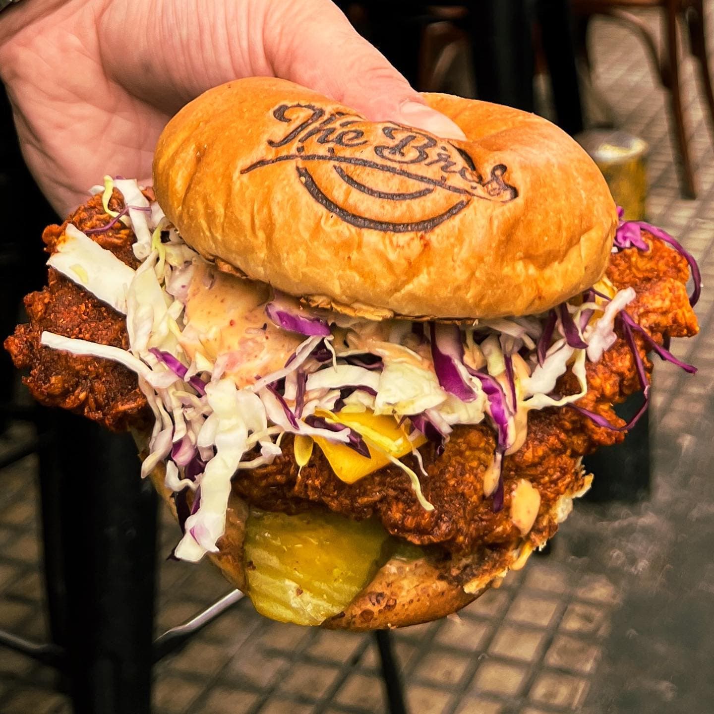Fried chicken burger with coleslaw and branded bun